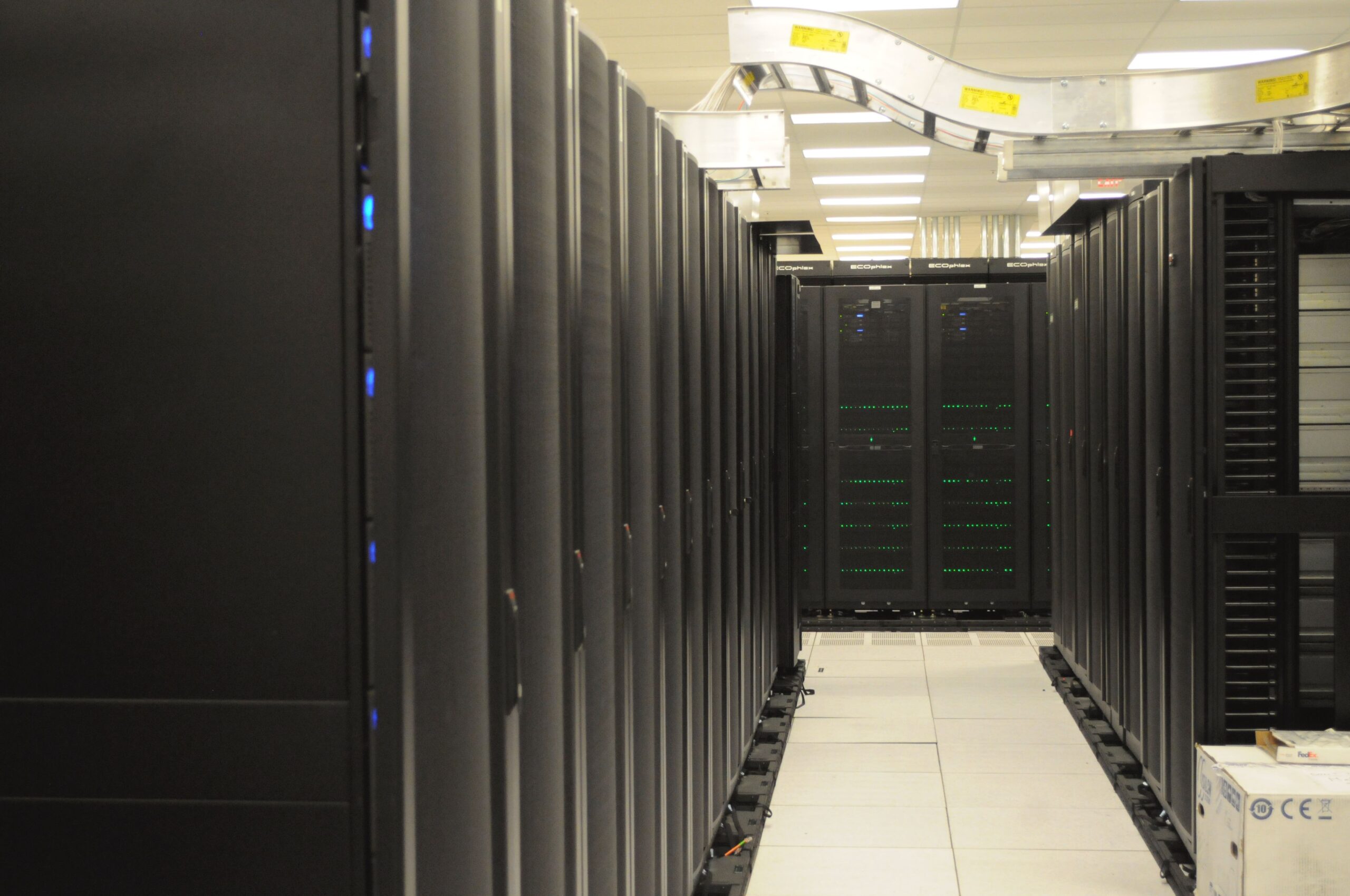 Server racks in a data centre, used as a high-performance-computing sector illustration