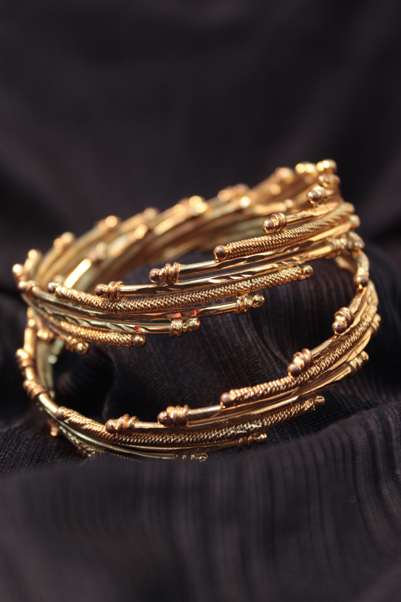 Gold-coloured bangles, used as a generic jewellery-sector illustration